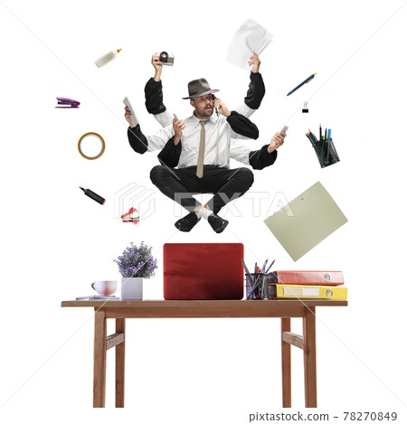 Handsome multi-armed journalist levitating isolated on yellow studio background with equipment 78270849