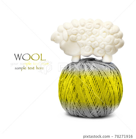 Yellow and gray ball of woollen thread isolated on white Yellow and gray ball of woollen thread isolated on white 78271916