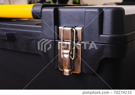 Metal lock on the tool box closeup 78274232