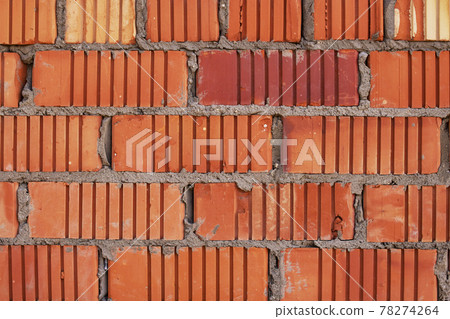 Wall of old corrugated red brick, background Wall of old corrugated red brick, background 78274264
