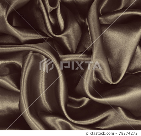 Smooth elegant brown silk or satin texture as abstract background. Luxurious background design. Sepia toned. Retro style Smooth elegant brown silk or satin texture as abstract background. Luxurious background design. Sepia toned. Retro style 78274272