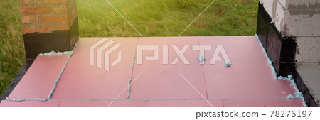 Construction foam between pink extruded styrofoam sheets Construction foam between pink extruded styrofoam sheets 78276197