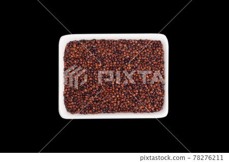 quinoa seeds in a in small white, oval ceramic bowl 78276211