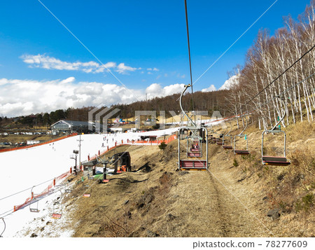 Ski resort with little snow on a sunny day 78277609