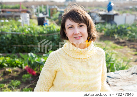 Portrait of woman in garden 78277846