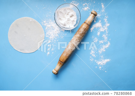baking dough with rolling pin on wooden table, top view baking dough with rolling pin on wooden table, top view 78280868