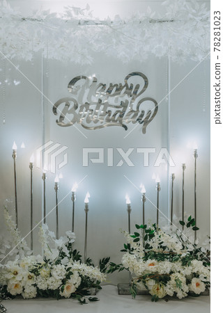 Happy Birthday party decoration the photo zone on a beige background. Festive background decoration for birthday celebration. Selective focus Happy Birthday party decoration the photo zone on a beige background. Festive background decoration for birthday celebration. Selective focus 78281023
