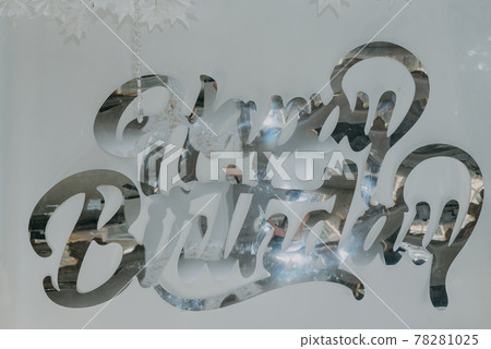 Close-up of a inscription Happy Birthday to decorate the photo zone on a beige background. Festive background decoration for birthday celebration. Selective focus Close-up of a inscription Happy Birthday to decorate the photo zone on a beige background. Festive background decoration for birthday celebration. Selective focus 78281025