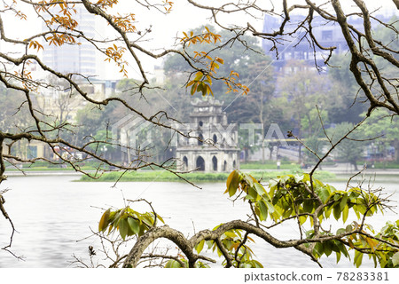 Turtle tower on the Hoan Kiem Lake (Ho Guom) with green trees in Hanoi, Vietnam. Turtle tower on the Hoan Kiem Lake (Ho Guom) with green trees in Hanoi, Vietnam. 78283381