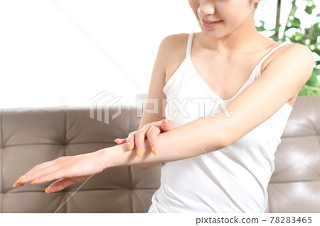 Image of a young woman doing body care Image of a young woman doing body care 78283465