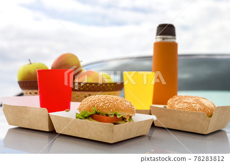 Outdoor picnic, on the hood of a car close-up 78283812