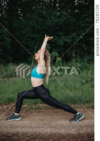 Woman in sportswear training in morning nature. Woman in sportswear training in morning nature. 78285726