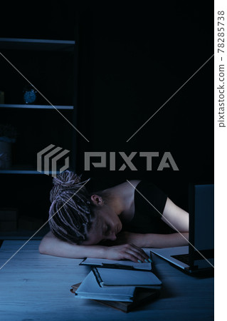 Businesswoman fell asleep near laptop, night work Businesswoman fell asleep near laptop, night work 78285738