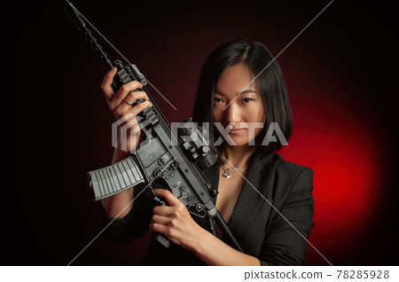 asian woman in a jacket with an automatic rifle in her hands mafia fighter asian woman in a jacket with an automatic rifle in her hands mafia fighter 78285928