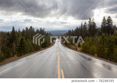 Scenic Road in the country side during a rainy stormy day. 78286595