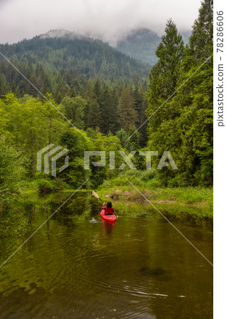 Adventure Caucasian Adult Woman Kayaking in Red Kayak 78286606
