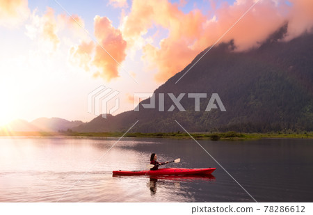 Adventure Caucasian Adult Woman Kayaking in Red Kayak Adventure Caucasian Adult Woman Kayaking in Red Kayak 78286612