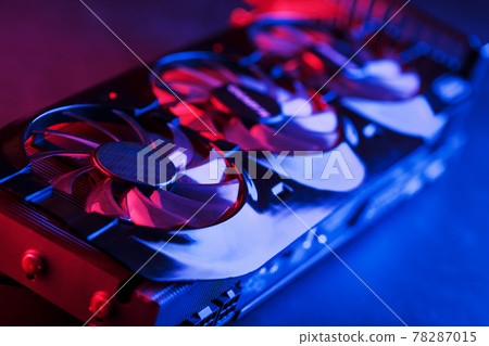 A close-up video card fan with cyanide magenta illumination in a futuristic style. A close-up video card fan with cyanide magenta illumination in a futuristic style. 78287015