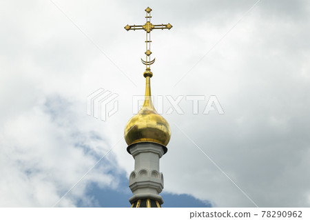 Golden cross on sky. Cross on the church roof 78290962
