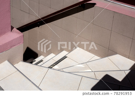 stairs downhill lined with ceramic tiles with a railing on the wall, exterior architecture close-up, nobody. stairs downhill lined with ceramic tiles with a railing on the wall, exterior architecture close-up, nobody. 78291953