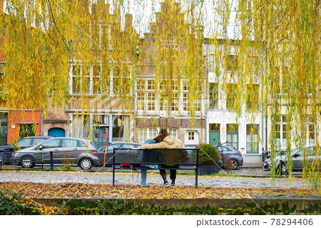 Couple resting under the willow Couple resting under the willow 78294406