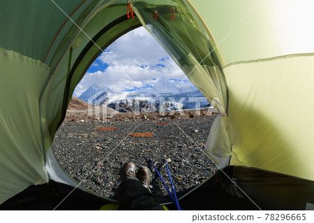 Hiker enjoy the beautiful landscape in tent Hiker enjoy the beautiful landscape in tent 78296665