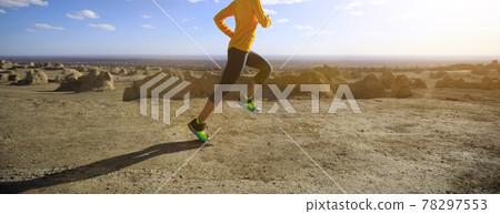 Fitness woman trail runner cross country running on sand desert Fitness woman trail runner cross country running on sand desert 78297553