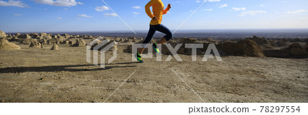 Fitness woman trail runner cross country running on sand desert Fitness woman trail runner cross country running on sand desert 78297554
