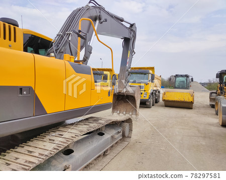 Modern hydraulic excavator on a field 78297581