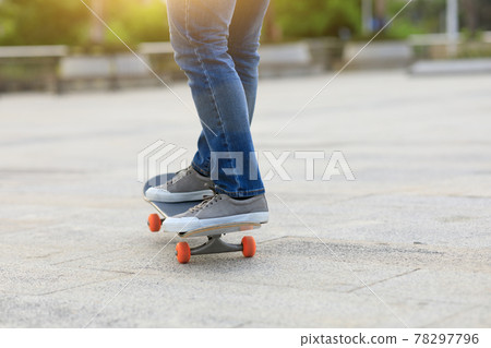 Skateboarder legs skateboarding at outdoors Skateboarder legs skateboarding at outdoors 78297796