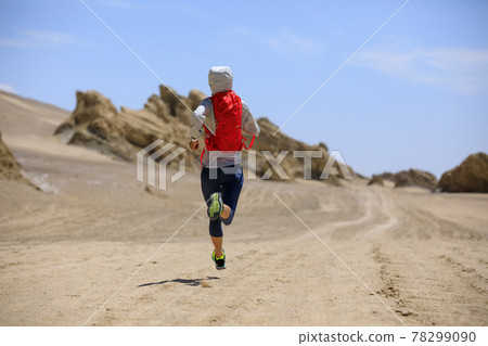 Fitness woman trail runner cross country running on sand desert Fitness woman trail runner cross country running on sand desert 78299090