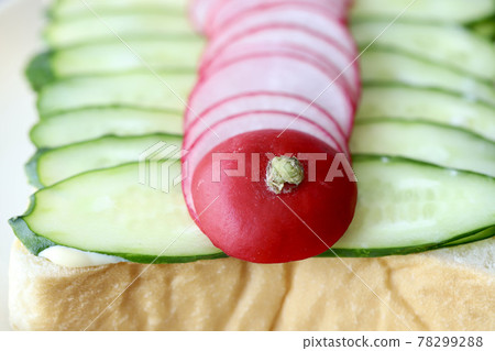 Cucumber and radish open sandwich with topping 78299288