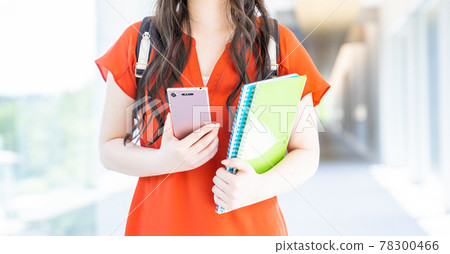 Young college girl walking in the corridor 78300466