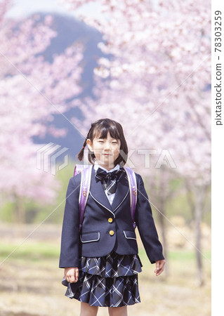 First grader carrying a school bag 78303259