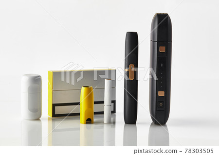 One pack, new generation black electronic cigarette, yellow cap, battery, cleaner, one heatstick isolated on white. Heating tobacco system. Close up 78303505