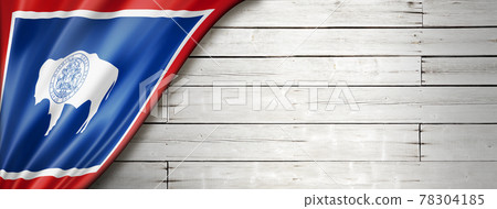 Wyoming flag on white wood wall banner, USA 78304185