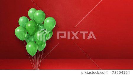 Green balloons bunch on a red wall background. Horizontal banner. Green balloons bunch on a red wall background. Horizontal banner. 78304194