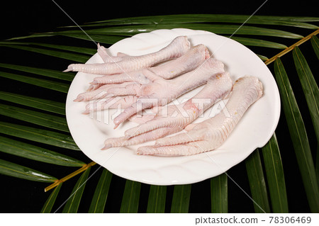 Fresh chicken feet on plate Fresh chicken feet on plate 78306469