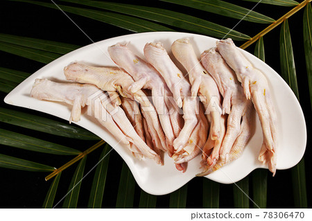 Fresh chicken feet on plate Fresh chicken feet on plate 78306470