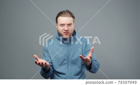 Photo of asking blond man in blue sweatshirt Photo of asking blond man in blue sweatshirt 78307049