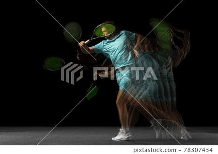 Young Caucasian man, professional tennis player isolated on black background in mixed neon light. Stroboscope 78307434