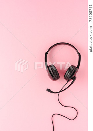 Customer service headset on pink background. Call center concept 78308751