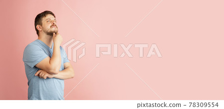 Flyer. Half-length portrait of young Caucasian man isolated on light pink background. Flyer. Half-length portrait of young Caucasian man isolated on light pink background. 78309554