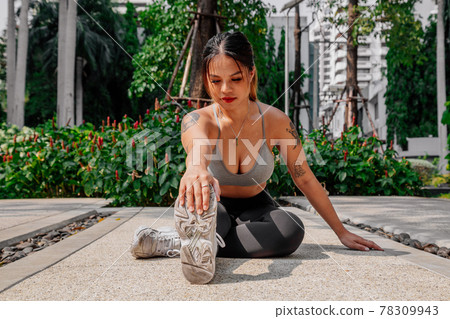 Asian sport girl doing stretching, yoga fitness and plank exercise outside. Fit young thai woman 78309943