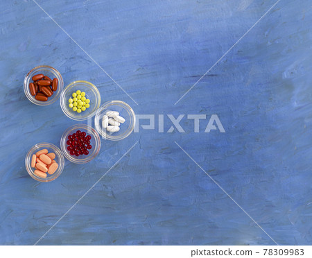A group of drugs on a blue background. 78309983