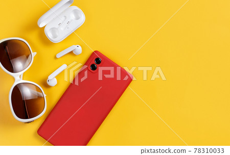 Smartphone, wireless earphones and sunglasses Smartphone, wireless earphones and sunglasses 78310033