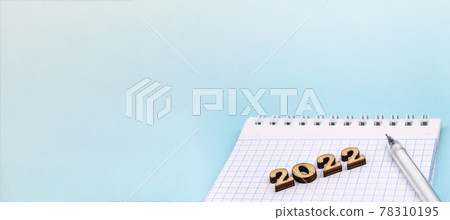 Figures 2022 on blue background. Banner 2022 and notepad. Figures 2022 on blue background. Banner 2022 and notepad. 78310195