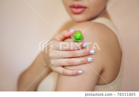 Crop woman with ice cubes for skincare routine Crop woman with ice cubes for skincare routine 78311805