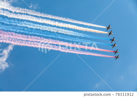 Moscow, Russia - May, 05, 2021: Eight attack aircrafts Su-25 fly with smoke, painted in the colors of the Russian flag. Parade in honor of Victory in the Great Patriotic War in Moscow. 78311912