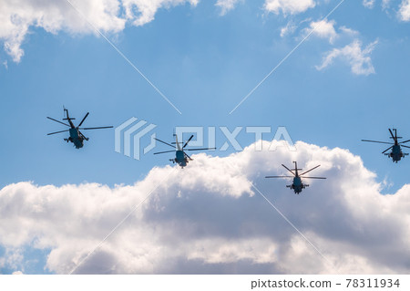 Moscow, Russia - May, 05, 2021: MI-8 multipurpose helicopters fly over Red Square during the General rehearsal of the parade celebrating Victory Day in Moscow. Moscow, Russia - May, 05, 2021: MI-8 multipurpose helicopters fly over Red Square during the General rehearsal of the parade celebrating Victory Day in Moscow. 78311934